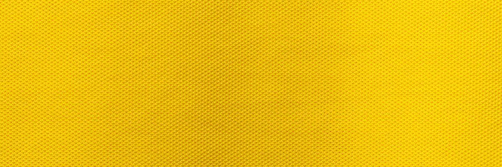 Yellow color sports clothing fabric football shirt jersey texture and textile background, Wide...