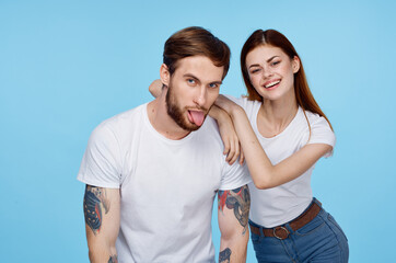 Fototapeta premium young couple white t-shirts fun tattoos for men
