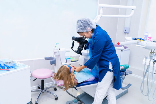 the dentist takes pictures of the teeth after treatment. 