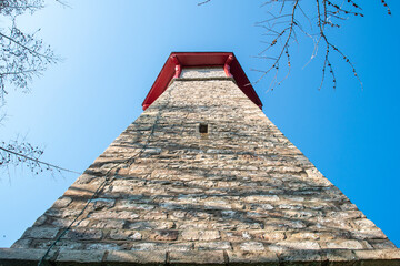 A view from the base of Gibraltar Point Lighthouse, looking up to the top on a bright sunny day in...