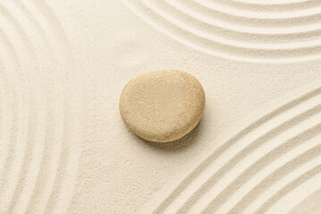 Fototapeta na wymiar Spa stone on light sand