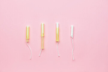 Menstrual tampons on pink background