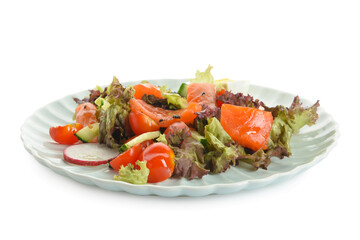 Delicious salad with salmon, egg and vegetables in plate on white background