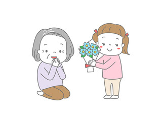 おばあちゃんに花束をプレゼントしている女の子