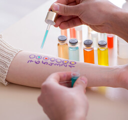 Doctor testing allergy reaction of patient in hospital