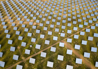 Aerial view of solar power station installed in green field