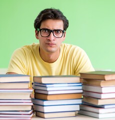 Student with too many books to read before exam