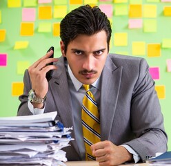 Businessman having trouble with his priorities