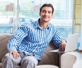 Caucasian student with laptop preparing for university exams