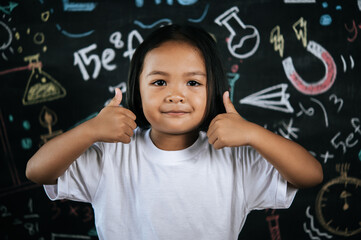 Portrait lovely girl front of education blackboard in background