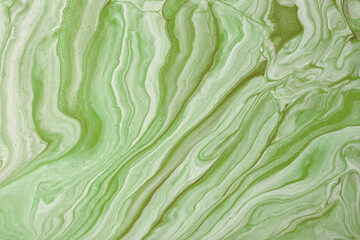 Obraz premium Abstract fluid art background green colors. Liquid marble. Acrylic painting on canvas with olive gradient and splash.