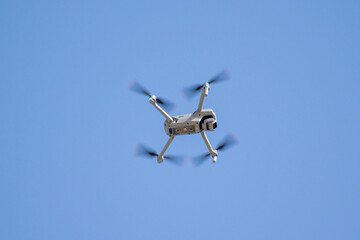 image of a drone flying through the sky