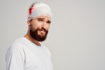 Man bandaged head and hand blood isolated background