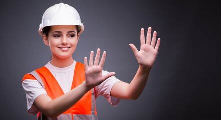 Cute construction worker pressing virtual buttons