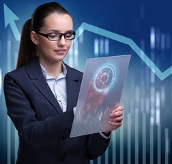 Businesswoman in stock exchange trading concept