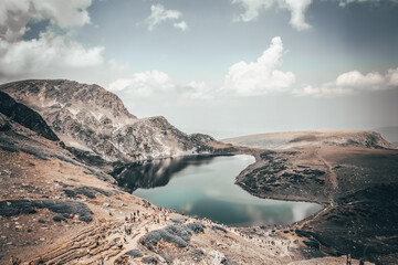Fototapeta na wymiar The Kidney - one of the Seven Rila Lakes, part of Rila National Park. Seven Rila Lakes are the most visited group of lakes in Bulgaria. Different image color