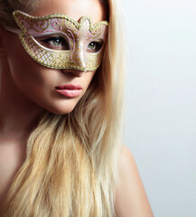 Beautiful young Woman in Mask. Blonde Girl