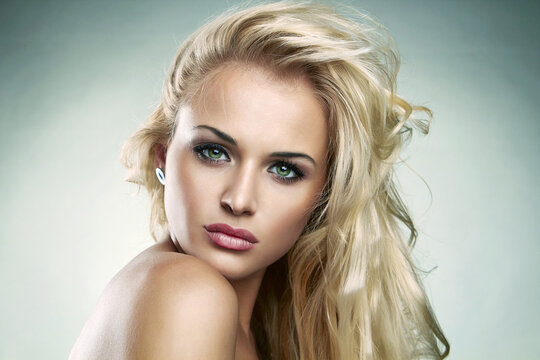 Beautiful Blond woman. amazing curly girl with make-up