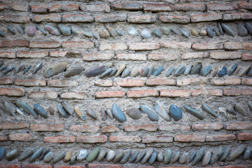 a wall of small stone is beautifully laid out as a texture