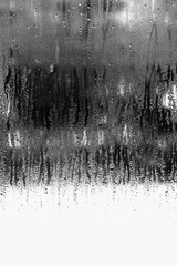 Vertical background of condensation on transparent glass with high humidity