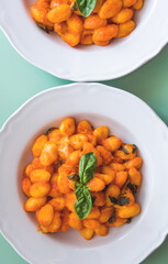 Italian potato gnocchi pasta with tomato sauce and mozzarella cheese