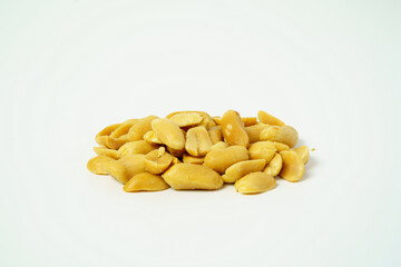 A pile of salty peanuts isolated on white background. Close up of peeled peanuts.