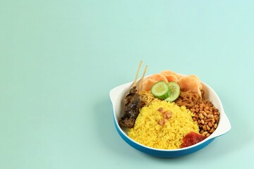 Nasi Kuning (Yellow Rice), Spice Steamed Rice with Turmeric and Other Spice. Served for Breakfast in Indonesia with Tempeh, Bihun, Noodle, and Egg.