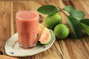Guava Juice on Tall Glass above Wooden Table