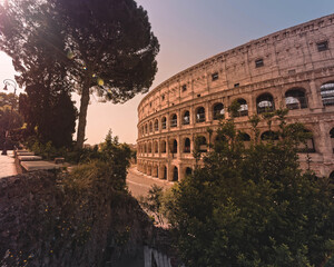Fototapeta na wymiar Rome Italy, view of the famous Colosseum amphitheater with impressive lens flare