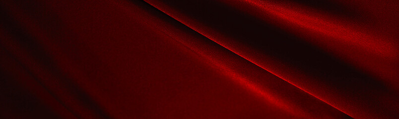 Red silk satin. Folds on the fabric.Elegant background with copy space for design. Web banner. Website header. Christmas, New Year, Valentine's Day, Valentine.