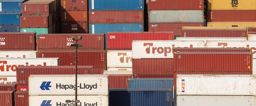 Bridgetown port, Barbados, West Indies - May 16, 2020: Bridgetown port. Tropical, Triton, MSC, Hapag-Lloyd, Cai, Tal, Zim shipping containers stored in the port. High angle shot. Aerial view