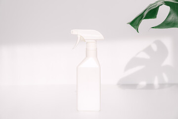 A white spray-type container.