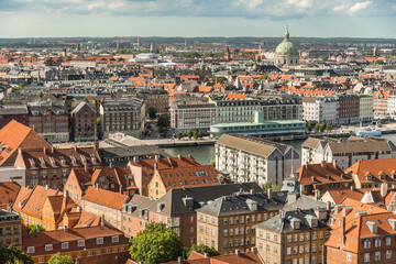 Fototapeta na wymiar The city of Copenhagen in Denmark from above on a slightly cloudy day