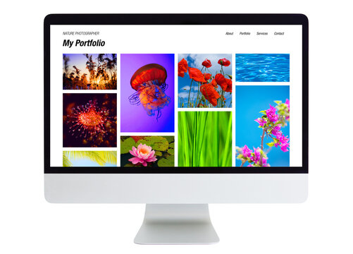 Isolated desktop computer with nature photography portfolio on the screen