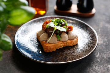 Sandwich with mousse, grilled mushrooms and chives.
Appetizing dish. Culinary photography, a proposal to serve a meal.