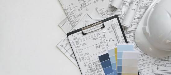 Architect works remotely from home in quarantine, lockdown covid 19 coronavirus. Remote work, stay home, new normality, social distance. Architect design working drawing sketch plans blueprints