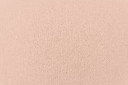 Blank nude tone pale or light soft orange color on recyclable paper texture minimalistic background