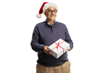 Mature man wearing a santa claus hat and holding a gift box