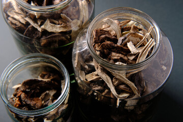 Dried mushrooms in a glass jar, side view
