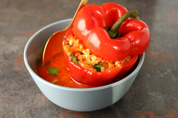 Stuffed pepper in bowl on dark textured background