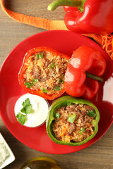 Concept of tasty food with ​stuffed pepper on wooden background