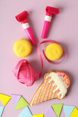 Birthday accessories on light violet background, top view