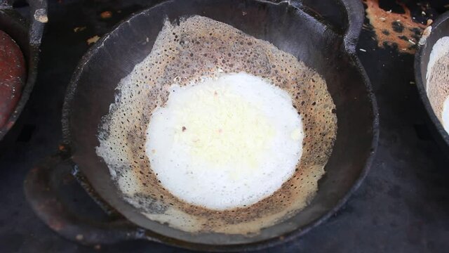 cooking traditional pancake or serabi from indonesia 