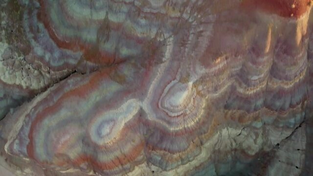 Aerial Top Forward Shot Of Natural Patterned Mountains At Paria Canyon-Vermilion Cliffs Wilderness Area - Paria River, Colorado