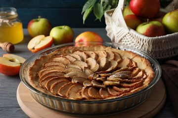 Concept of tasty food with apple pie on wooden table