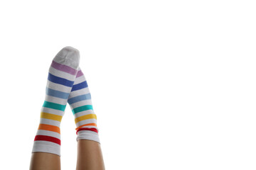 Female legs in rainbow socks isolated on white background