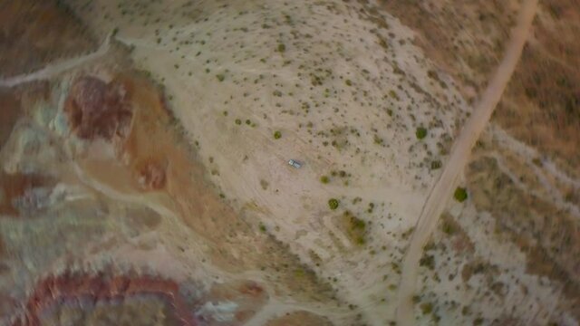 Aerial Top Panning Shot Of Vehicle Parked At Lees Ferry, Drone Flying Over Semi Arid Land - Paria River, Colorado