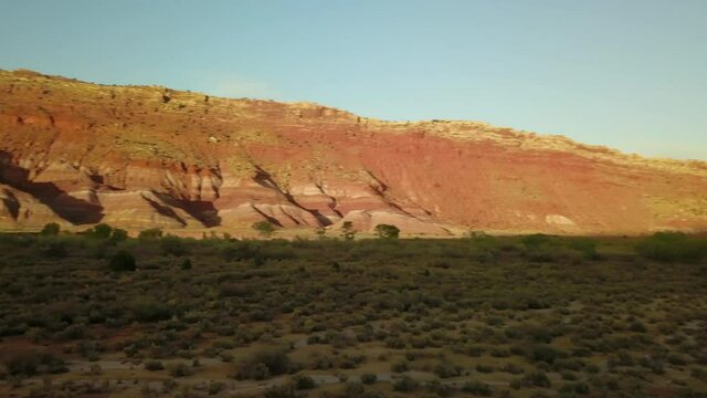 Aerial: Panning Shot Of Paria Canyon-Vermilion Cliffs Wilderness Area Against Sky - Paria River, Colorado