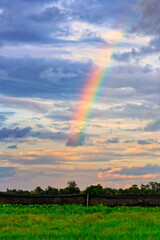 rainbow on cloudy sky background.