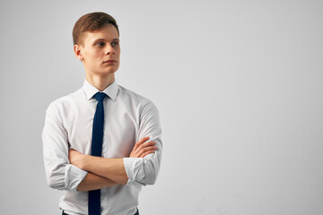 Cheerful man straightens his tie manager professional success